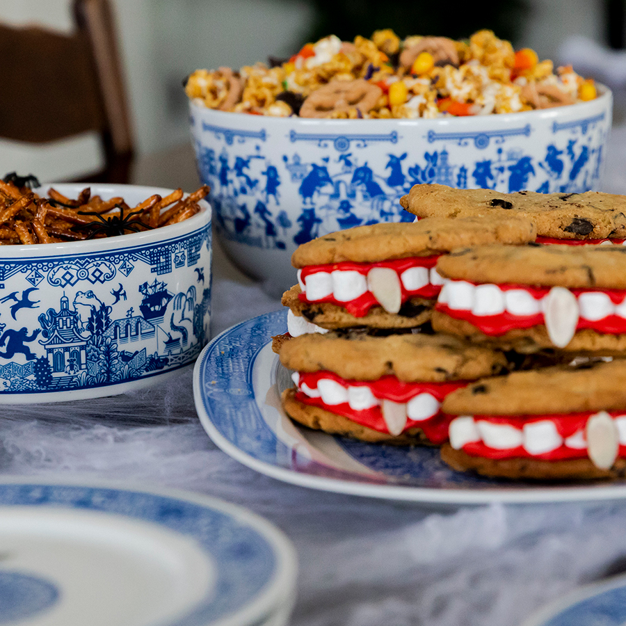 Halloween themed party snacks on Calamityware blue and white serving pieces with monsters.